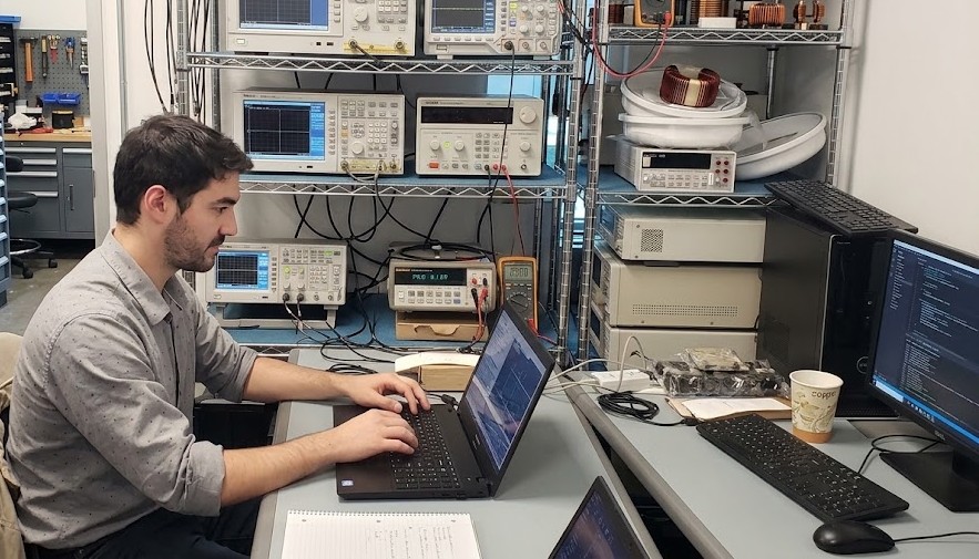 Developer writing software on a laptop